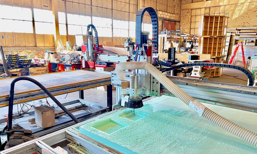 Cutting foam core molds at our South River Mills workshop.